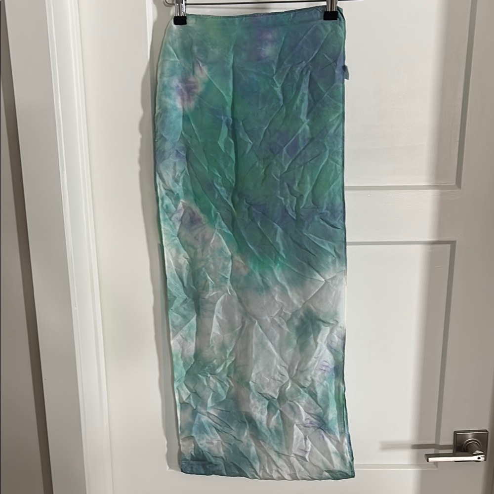 Vibrant tie-dye silk scarf with a blend of pastel green, purple & blue hues!